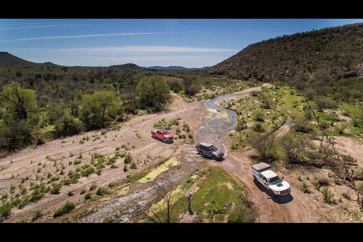 Ford F-150 Raptors crossing a river in Mexico