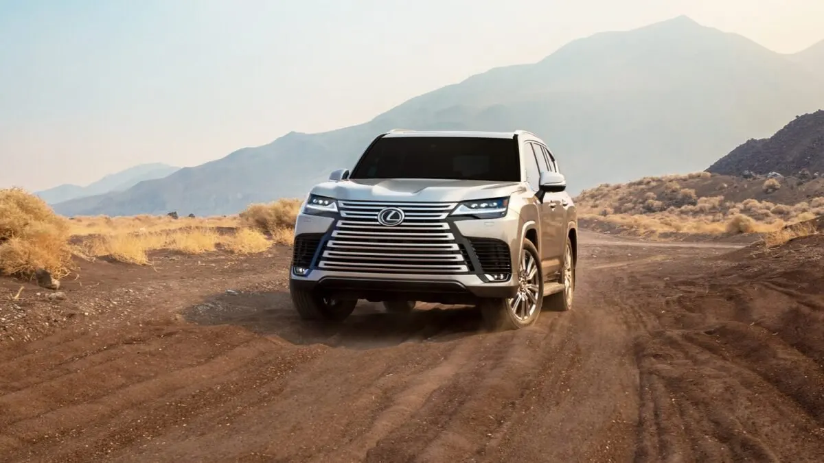 Lexus LX 600 driving on a dirt road in the hills