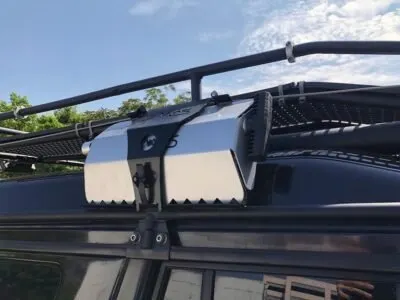 Aluminum storage box mounted on a roof rack