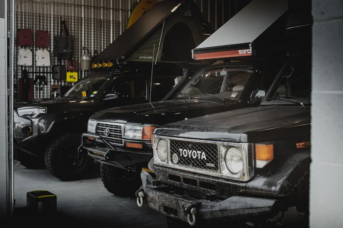 Toyota Land Cruisers parked inside the Spirit of 1876 shop