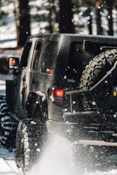 Jeep Wrangler on 40s in deep snow