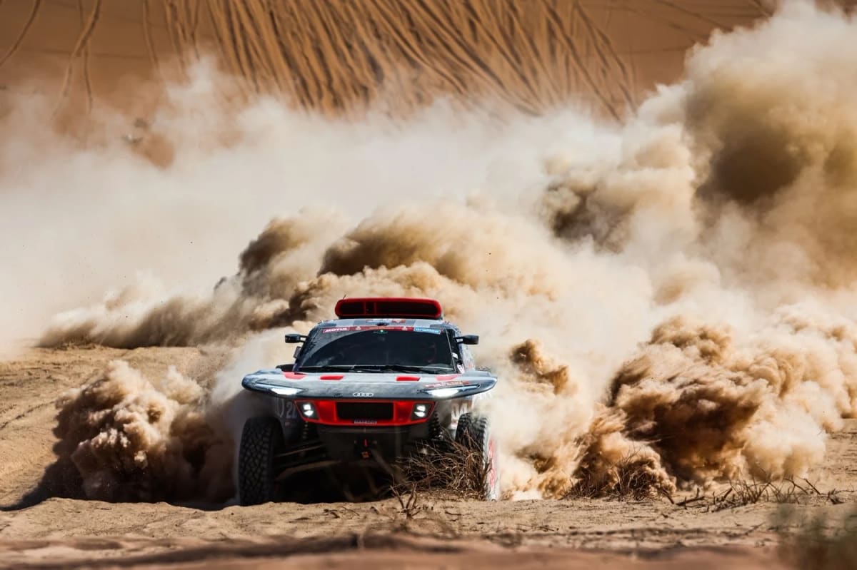 Audi ETron at the Dakar Race Crossing a Sand Dune